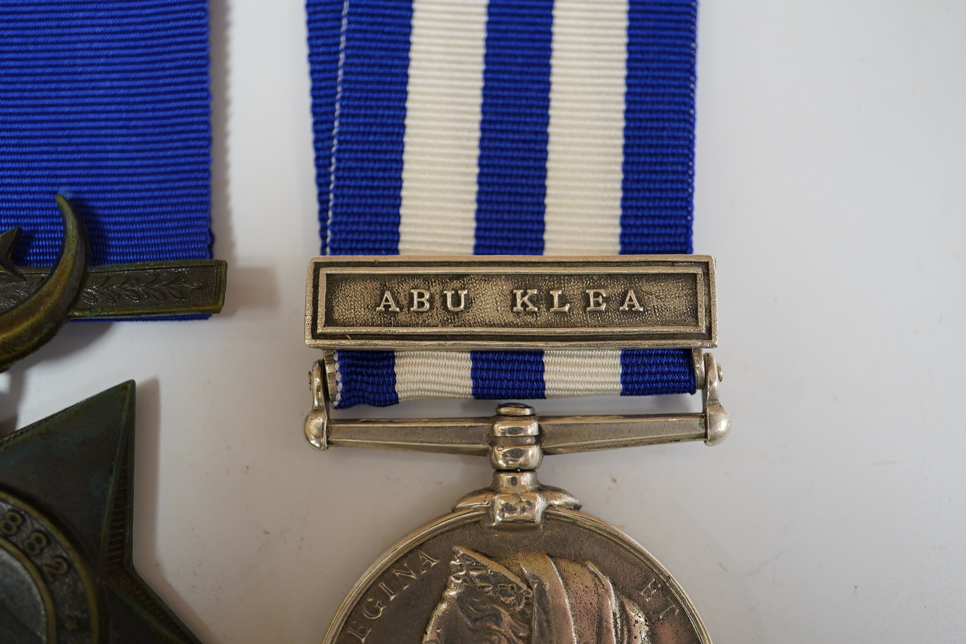 An Egypt Medal 1882-89 with Abu Klea clasp to Corpl H.Bennett 4th Coy. 2nd Batt. Gren. Gds. and a replica Khedive's Star 1882.